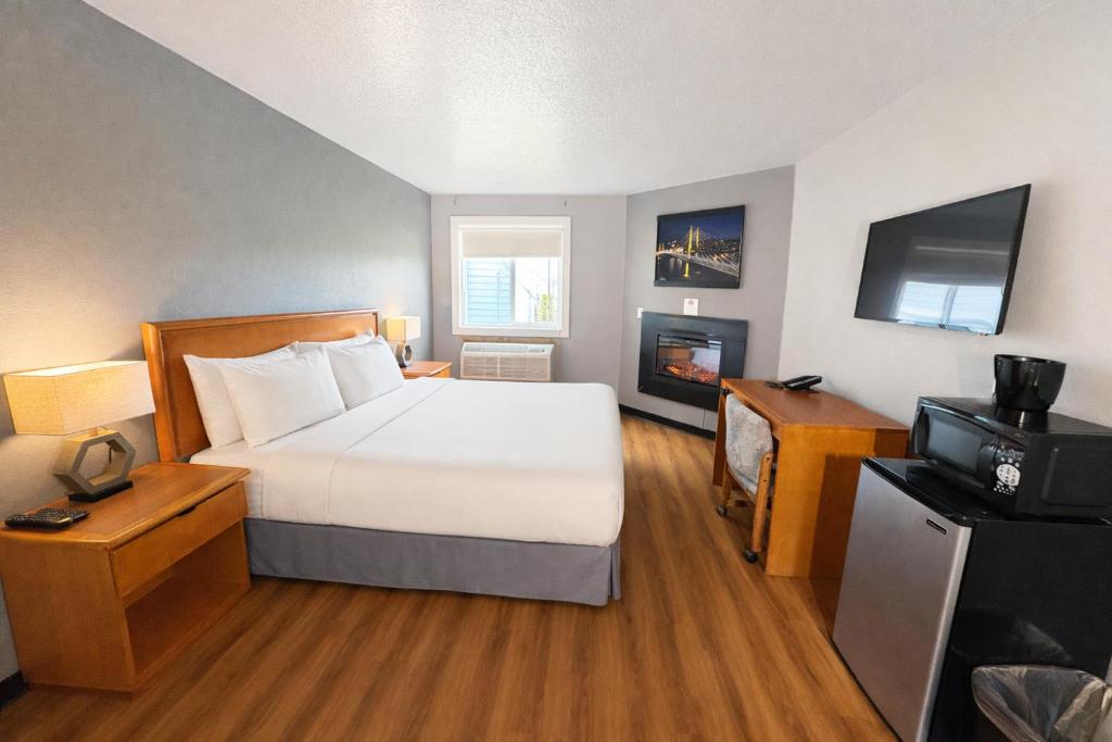 guestroom with king bed and sofa