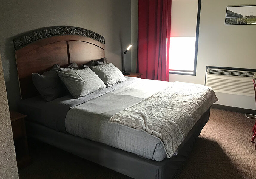 guest room with one king bed